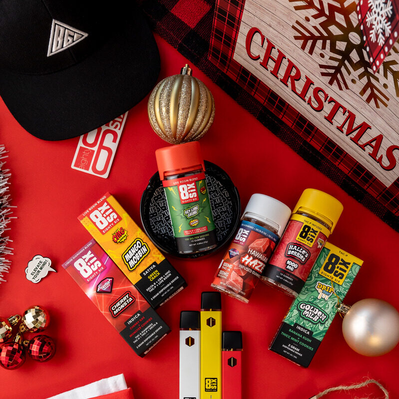 A variety of Eighty Six products on a table with Christmas decorations