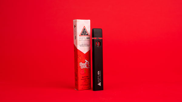 Berry Slush disposable vape pen on a red background