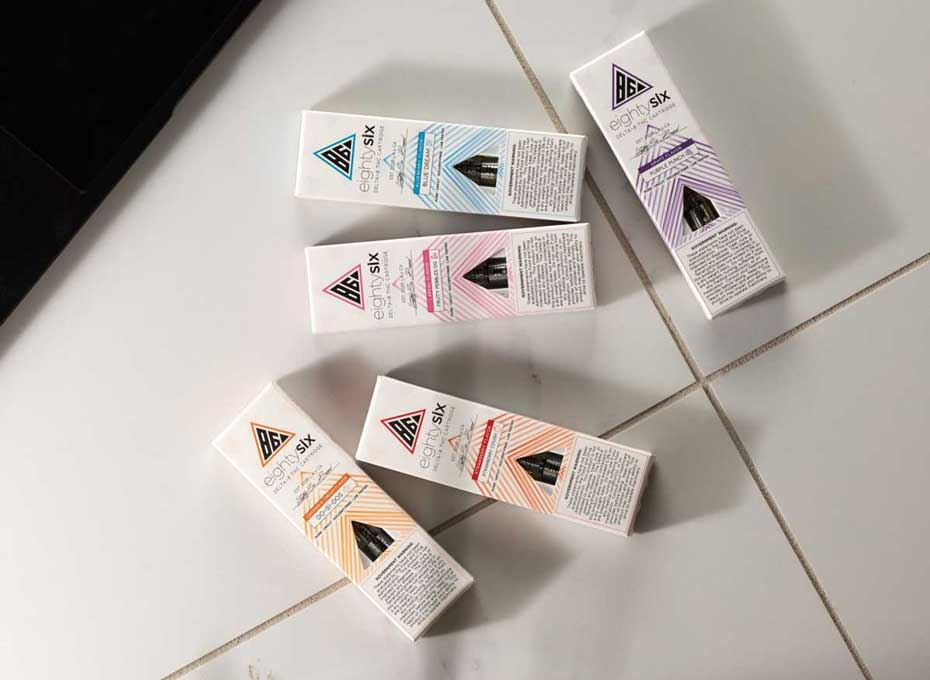 Delta-8 vape cartridges on a tile surface