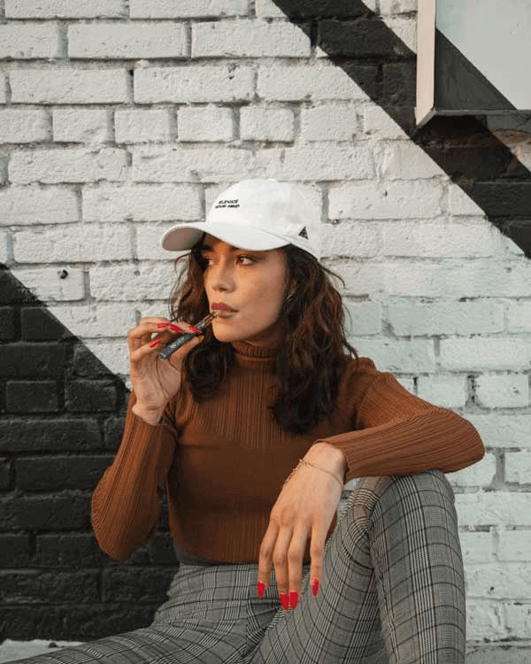 a girl vaping Delta-8