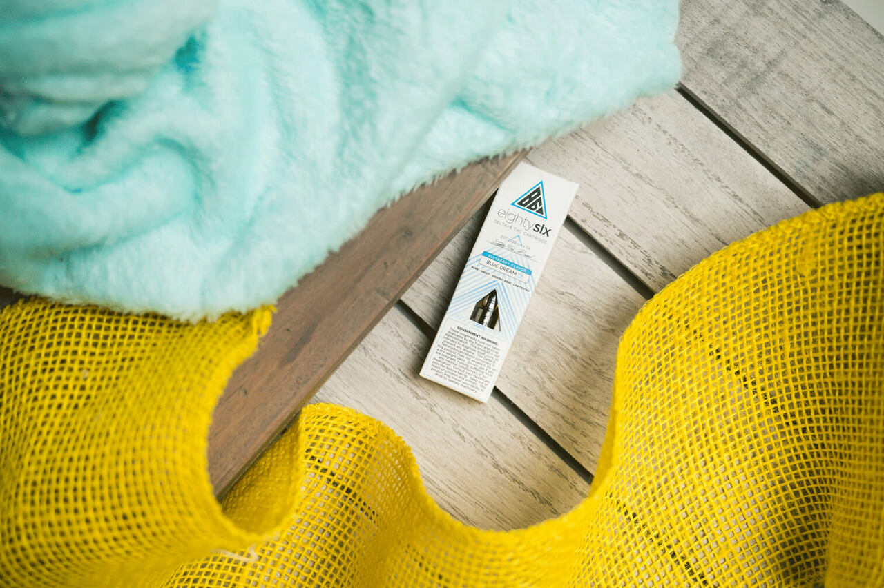 Blue Dream Delta-8 THC Vape Cartridge in the floor