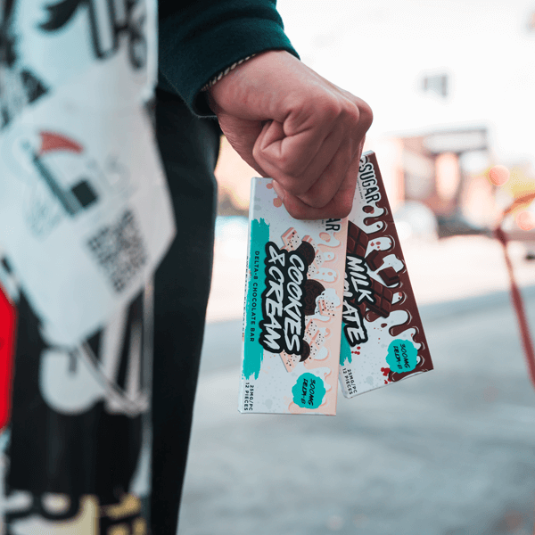 Person holding Delta-8 chocolate bars