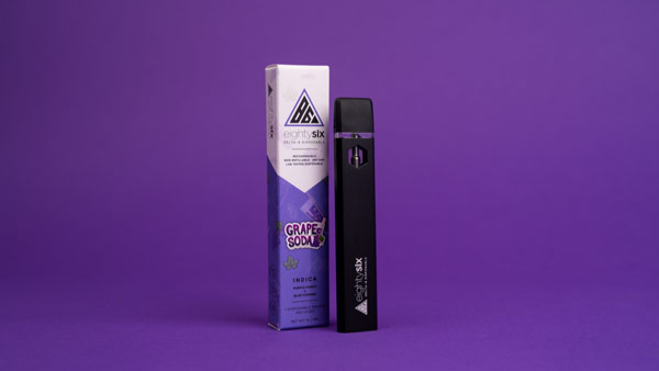 Grape Soda disposable vape on a purple background