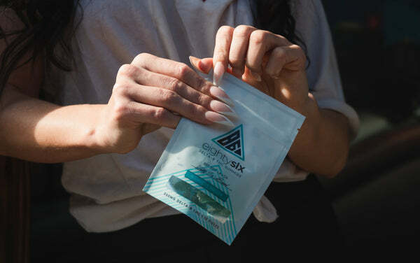 woman opening Delta-8 gummies